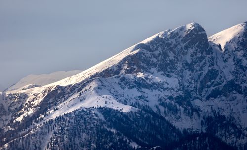 Free Stunning snow-covered peaks of the Dolomite mountains under soft winter sunlight. Stock Photo