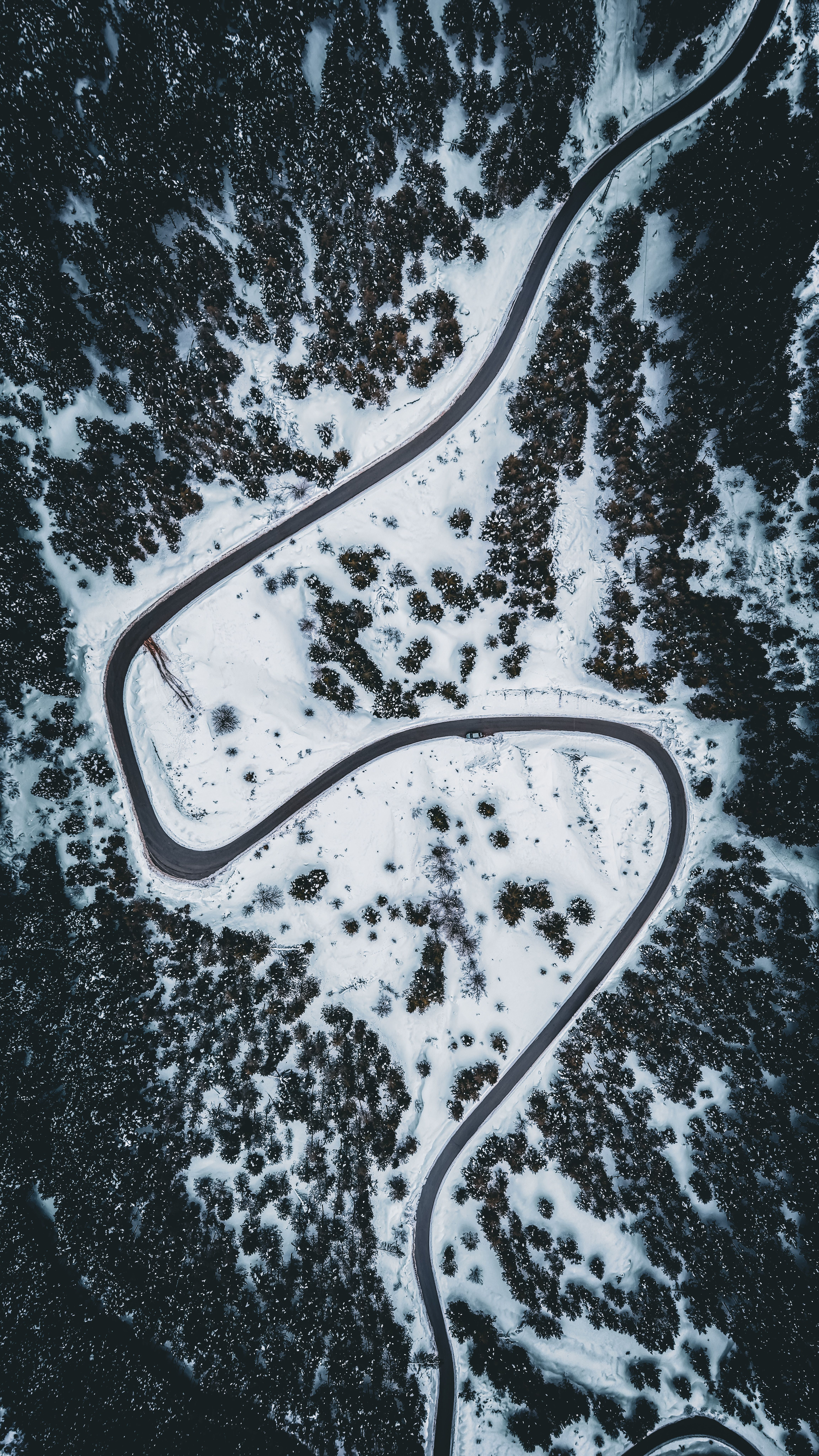 Aerial View of Snowy Winding Road in Winter · Free Stock Photo