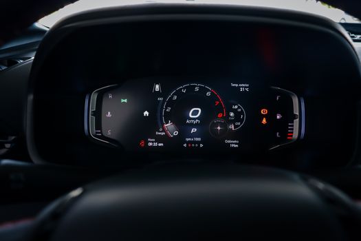 High-resolution image of a modern car dashboard with illuminated displays.