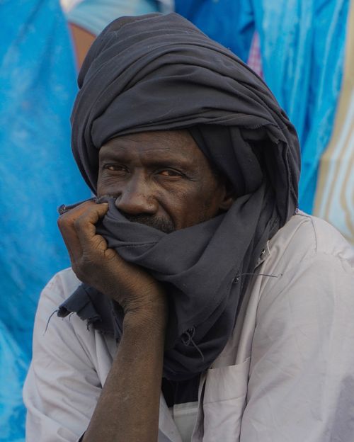 Free Portrait of an adult man wearing a traditional turban, deep in thought. Stock Photo