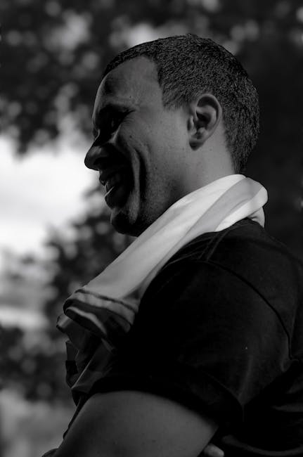 Black and white portrait of a man outdoors in Buenos Aires, highlighting a serene mood.
