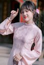 Young Woman in Traditional Pink Ao Dai Dress