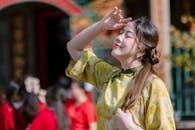 Young Woman Enjoying Sunlight in Traditional Attire