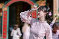 Elegant Woman in Traditional Pink Outfit Outdoors