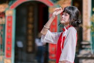Young Woman in Traditional Red Dress Outdoors