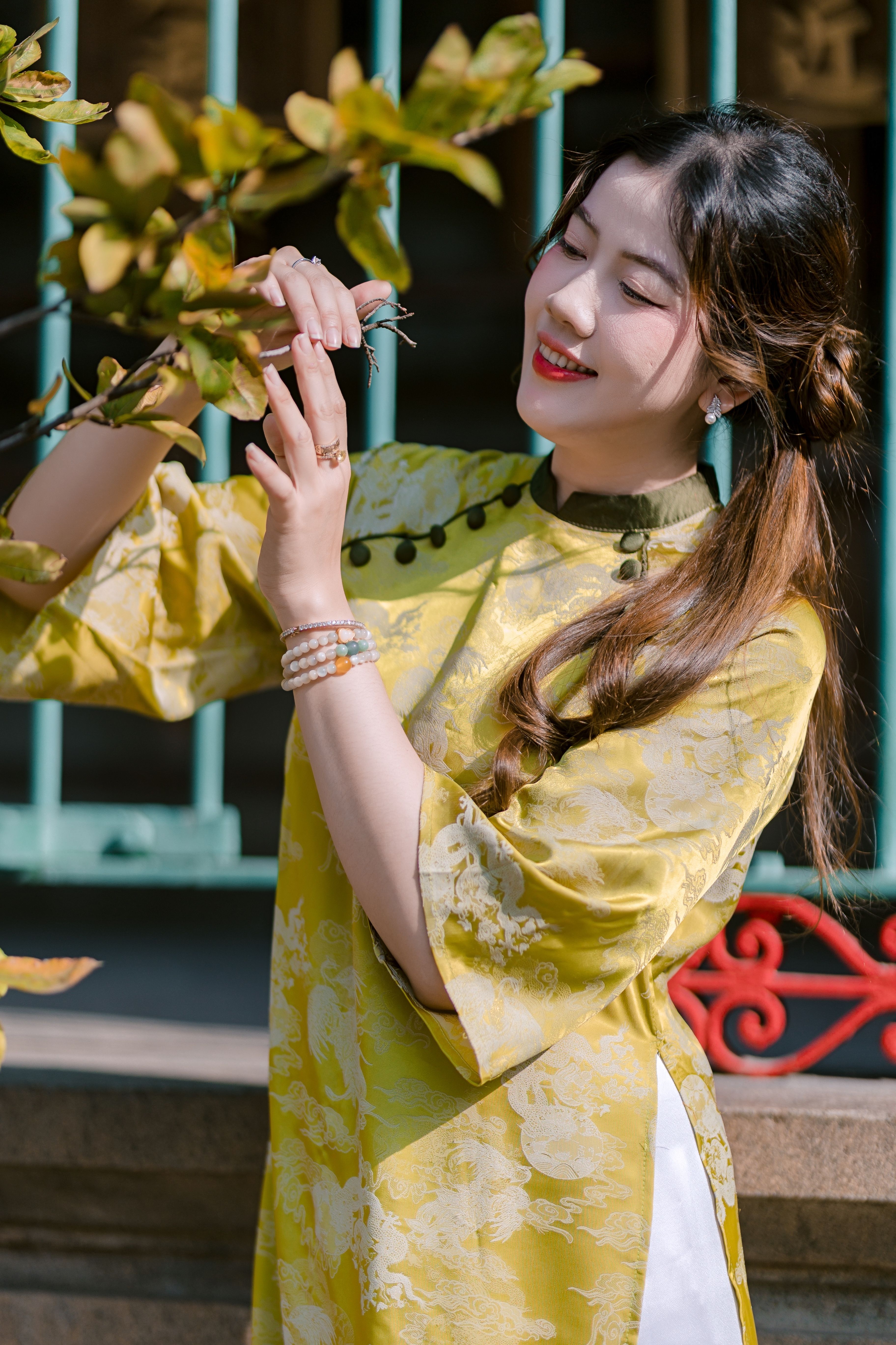 Elegant Woman in Traditional Yellow Dress Outdoors · Free Stock Photo