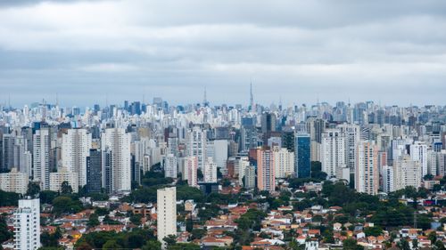 Free Expansive skyline of São Paulo with clouds creating a dramatic urban vista. Stock Photo