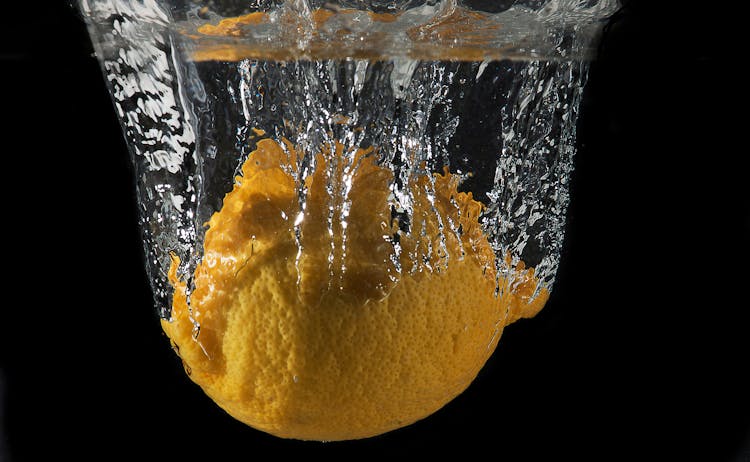 Water Splash On Yellow Round Lemon