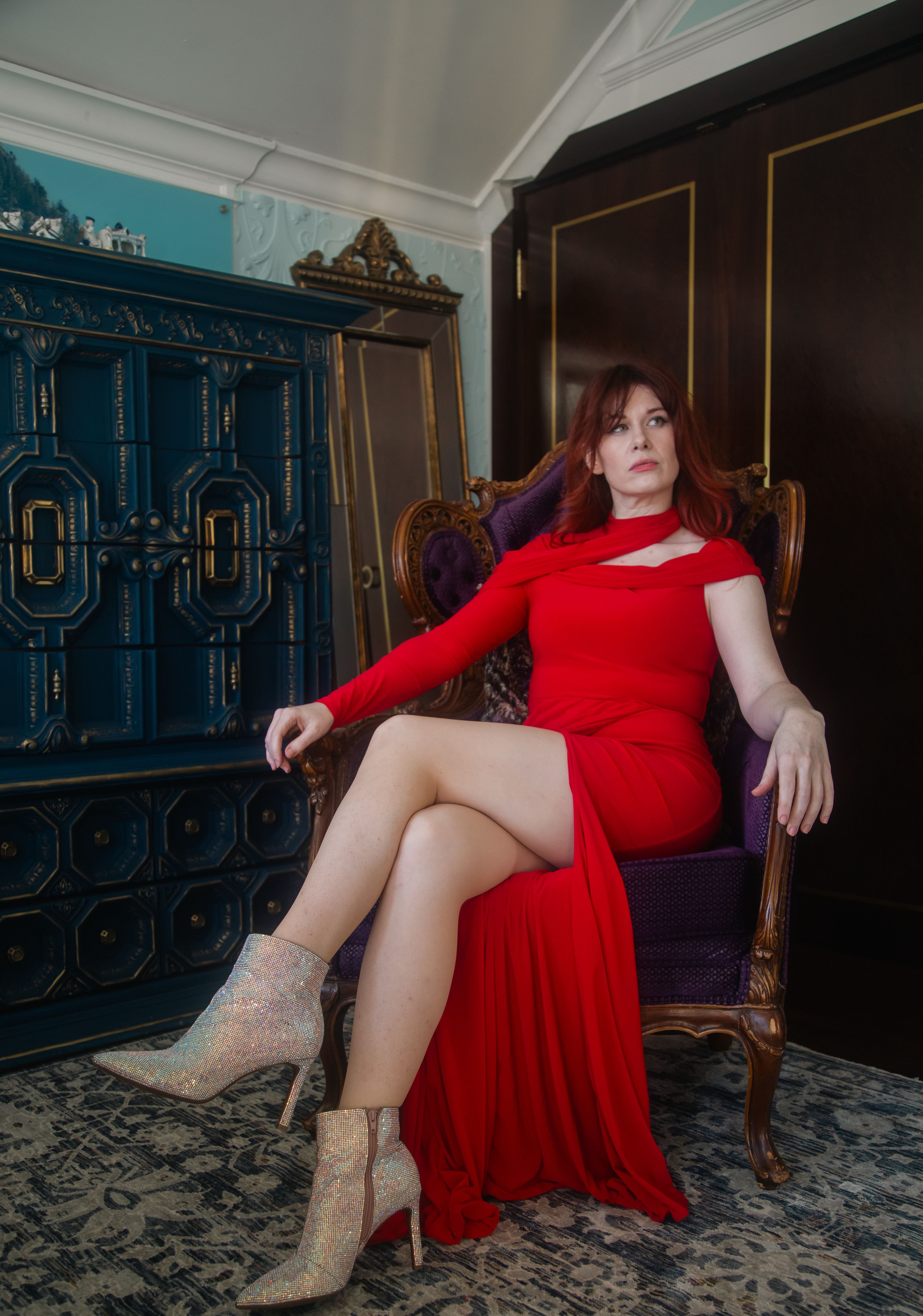 Elegant Woman in Red Dress Sitting on Vintage Chair · Free Stock Photo