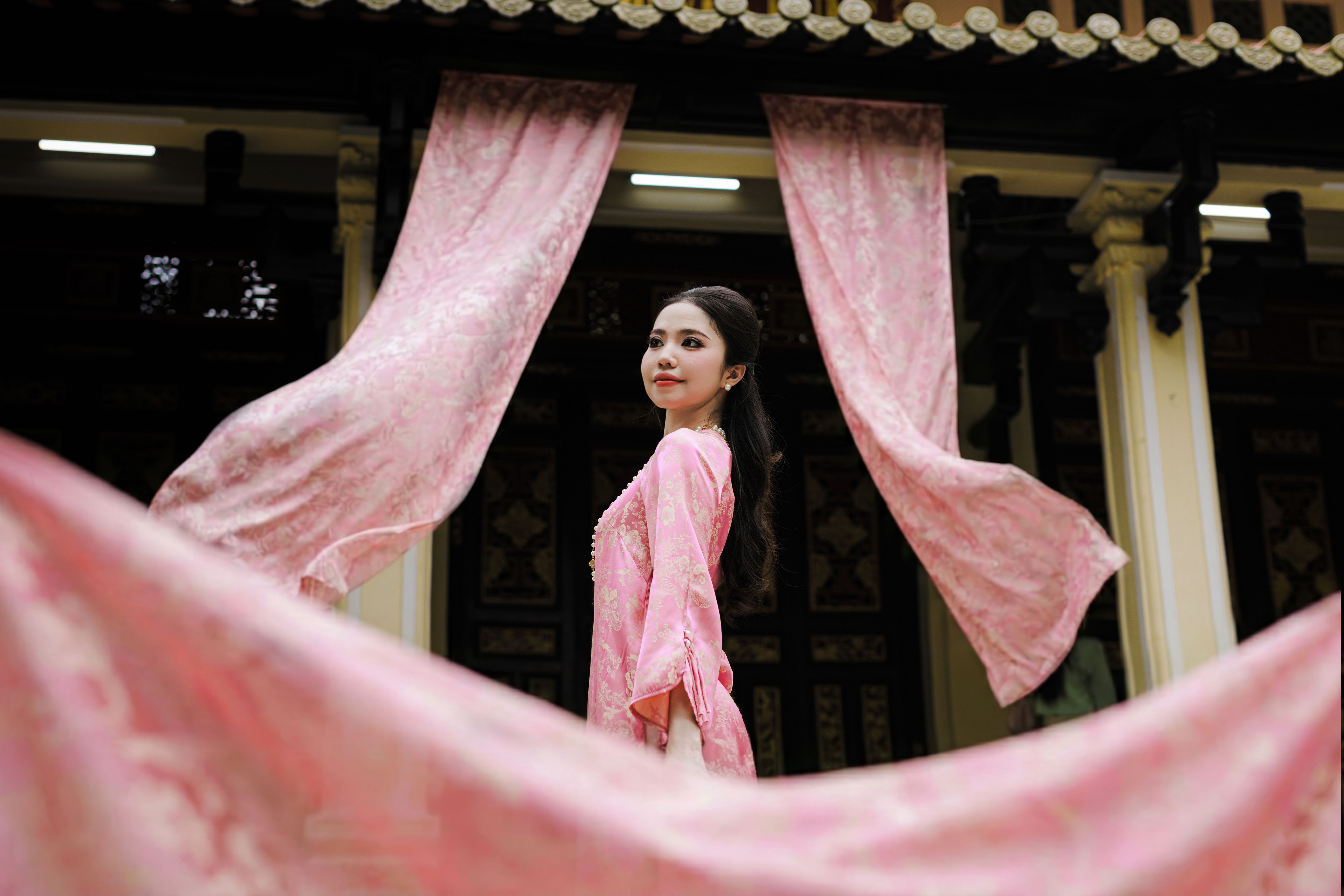 Elegant Woman in Traditional Pink Robe · Free Stock Photo