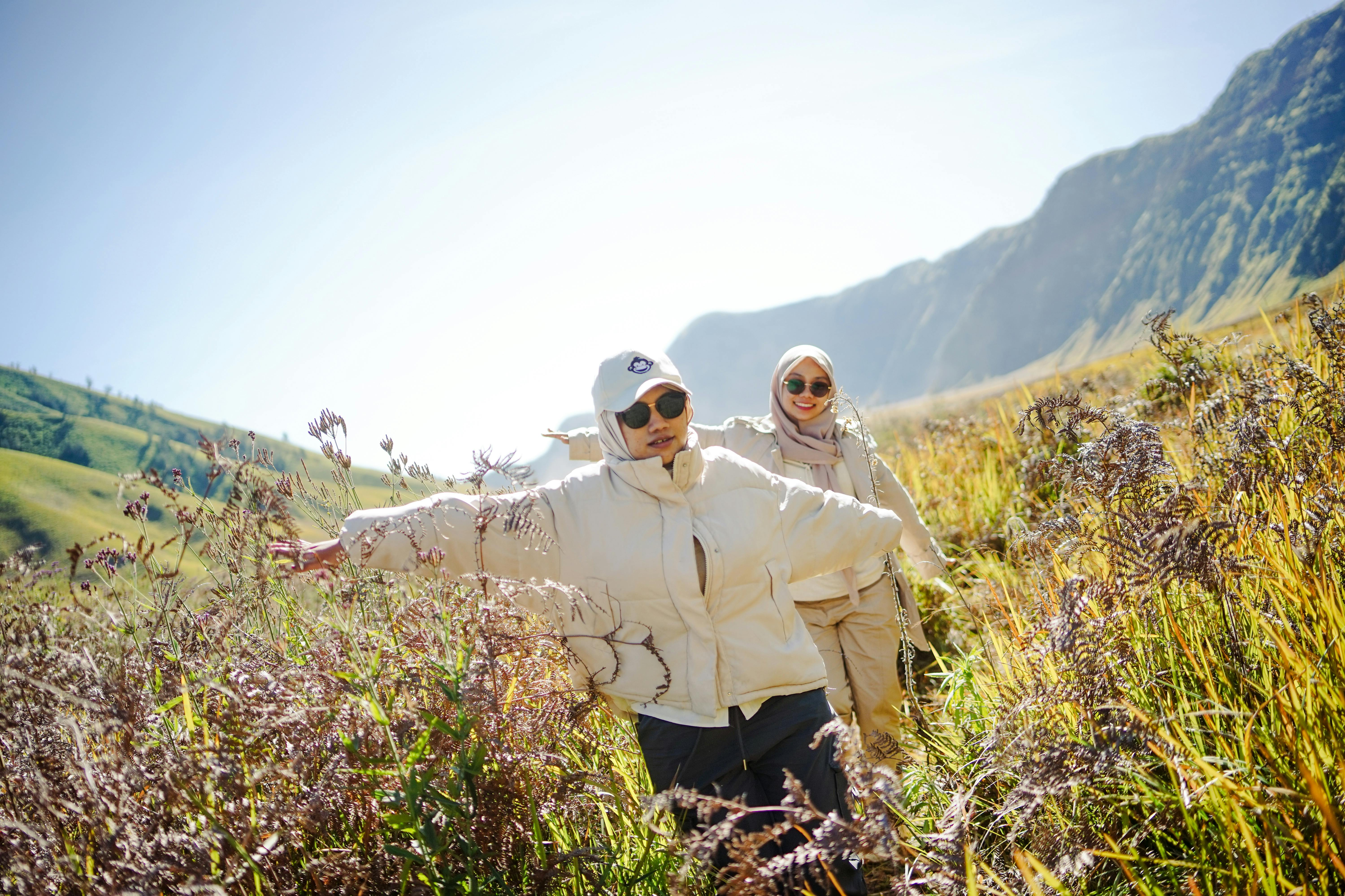 Two friends enjoying a sunny day exploring the savanna near Mount Bromo, East Java.