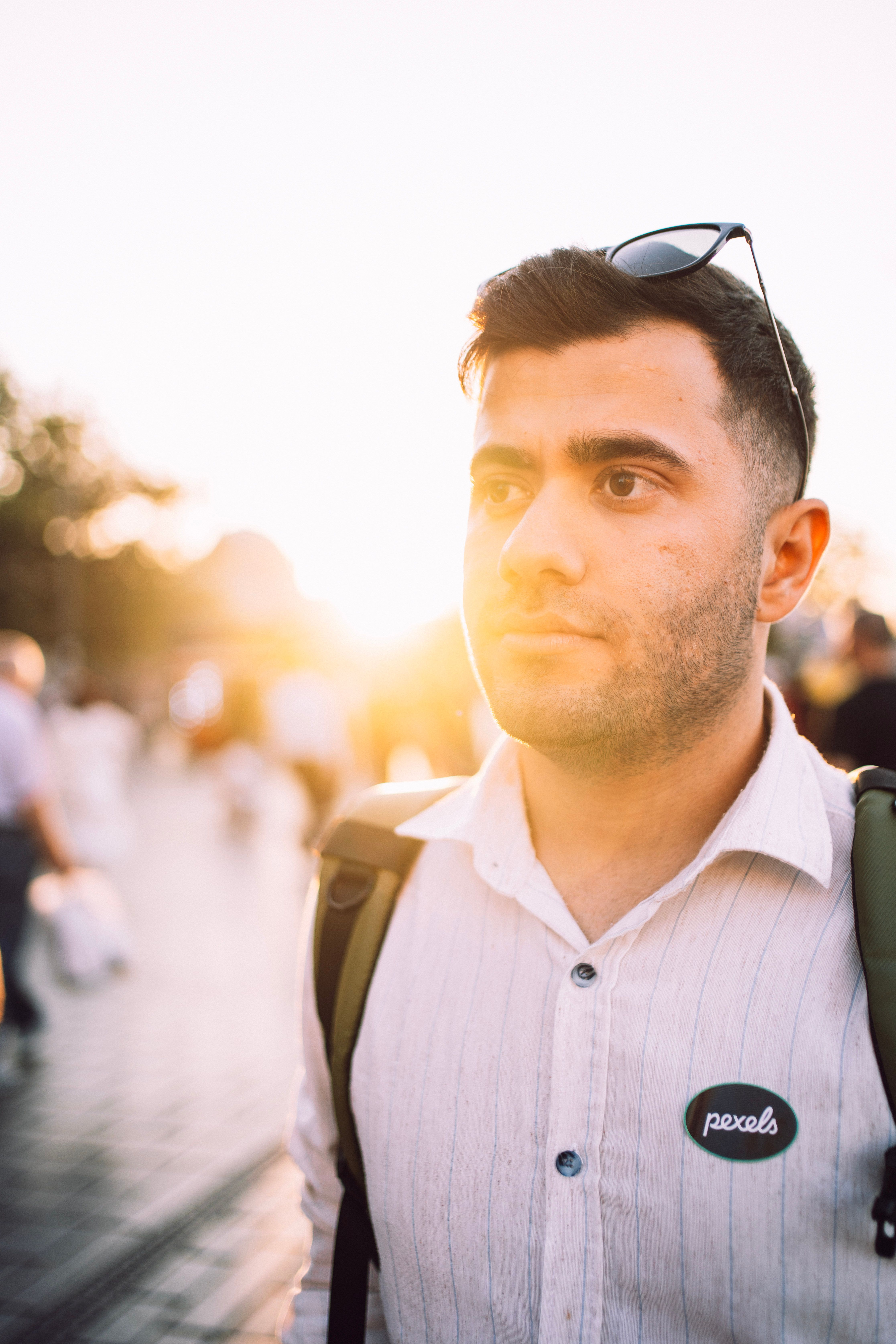 A young man with sunglasses in İstanbul during sunset, capturing a modern street vibe.