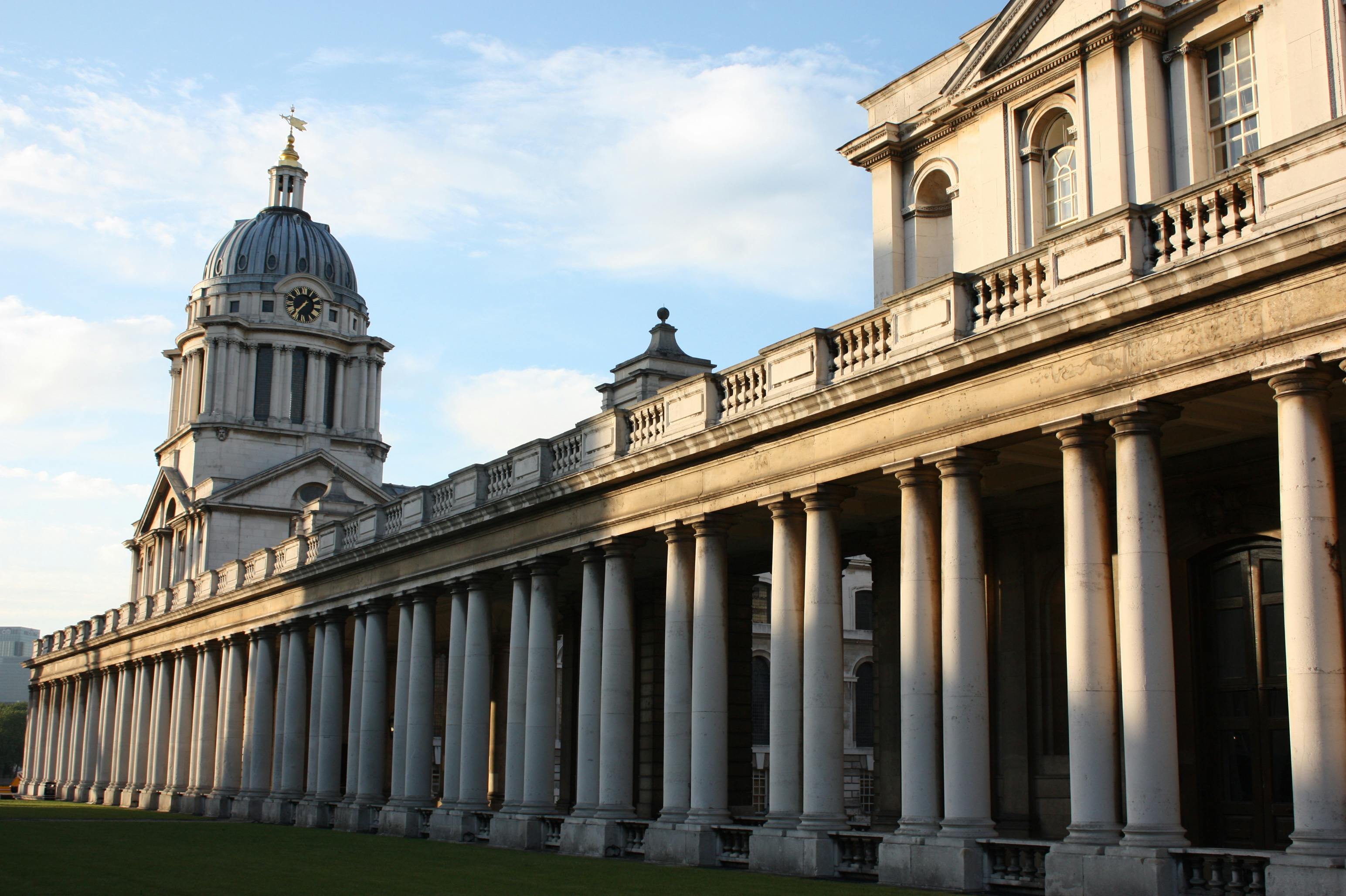 View of historic Greenwich Chapel with its iconic pillars and dome in the morning light.