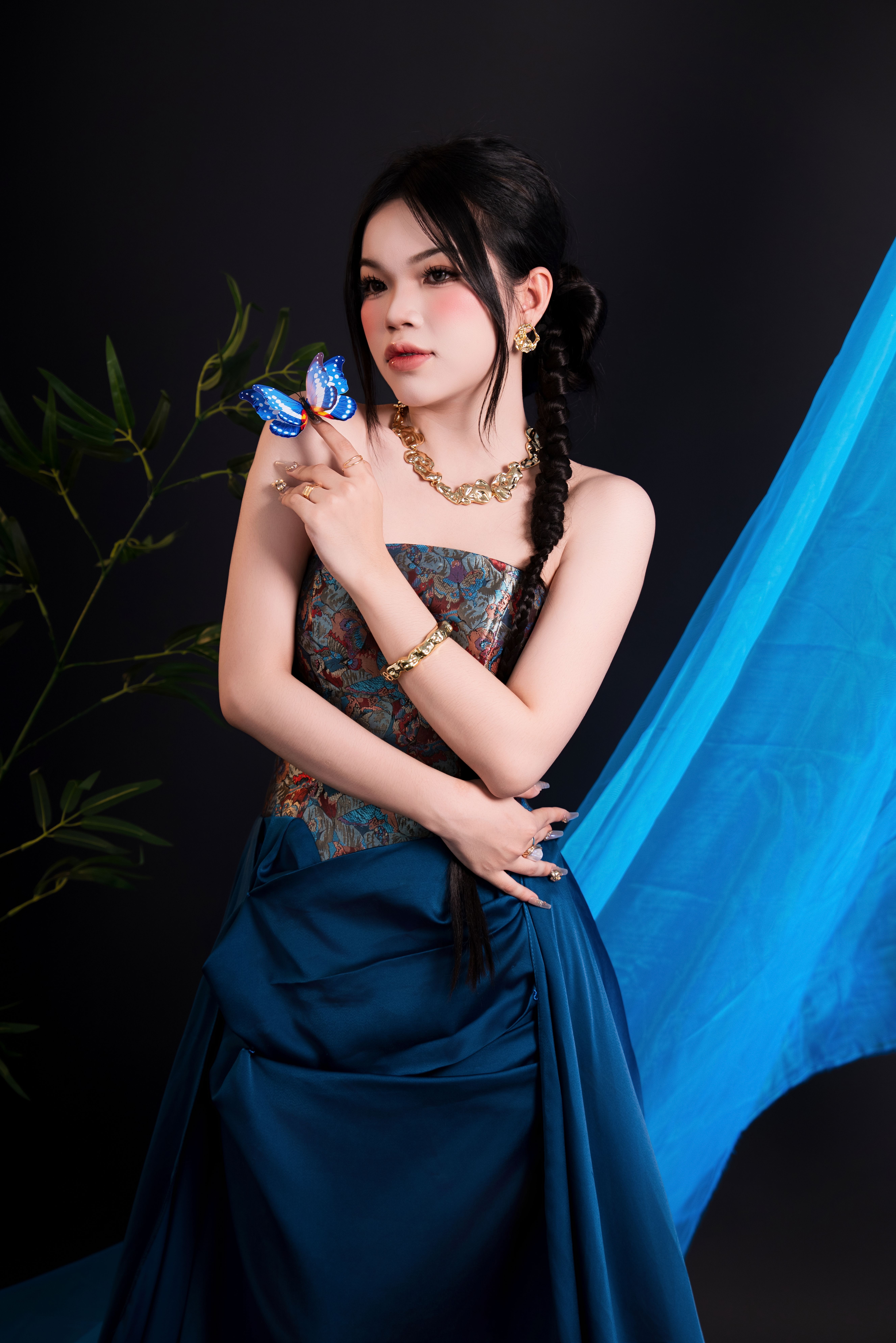 Elegant Woman with Butterfly-Themed Dress · Free Stock Photo