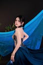Elegant Woman in Blue Dress with Flowing Fabric