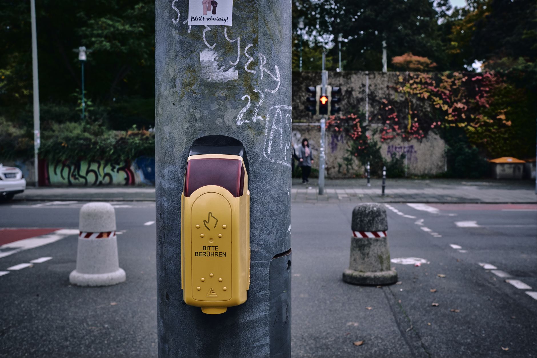 Pedestrian crossing with touch button and traffic light in Darmstadt, Germany.