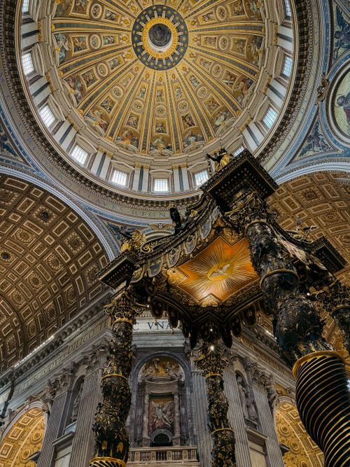 Free Beautiful view of St. Peter's Basilica's ornate interiors highlighting the magnificent dome and altar. Stock Photo
