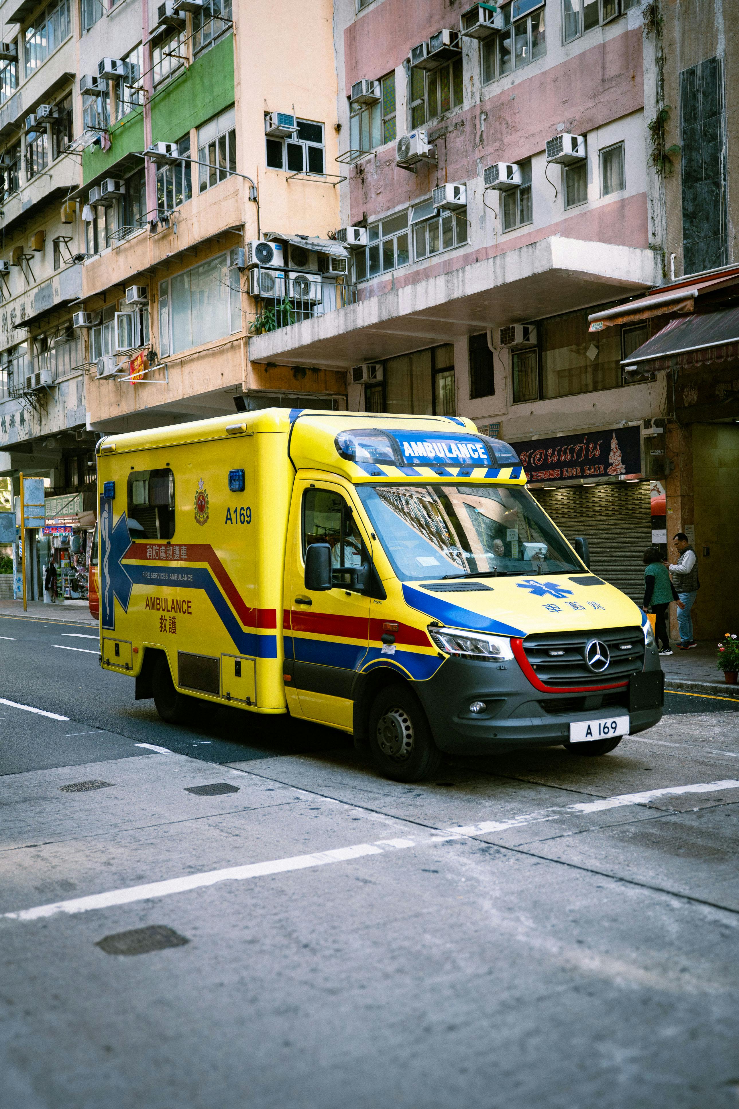 Bright Ambulance on Busy Urban Street