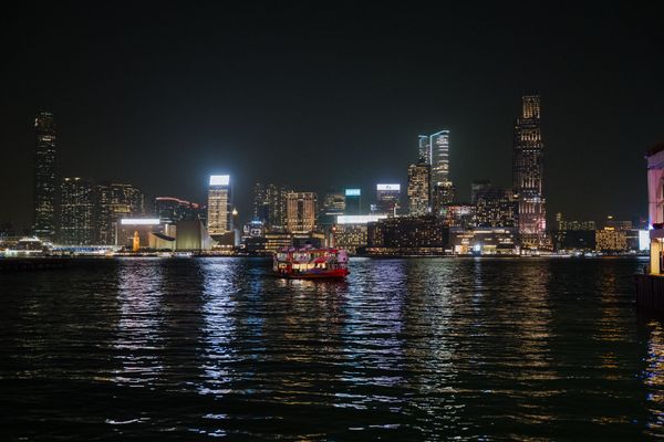 Harbour lights reflected on water at night — photo by Arnold Nagy on Pexels