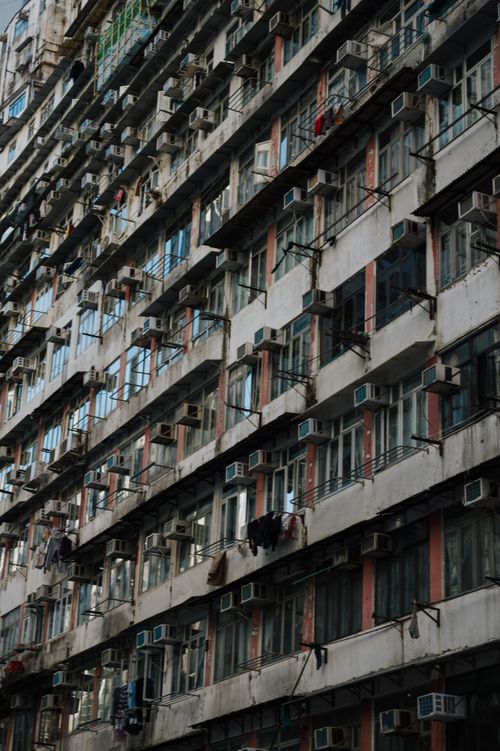 Free Exterior view of high-density urban apartments with visible air conditioning units. Stock Photo