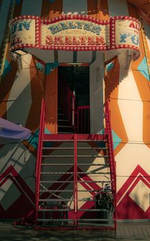 Vibrant helter skelter ride entrance at a fair. Captures the essence of fun.