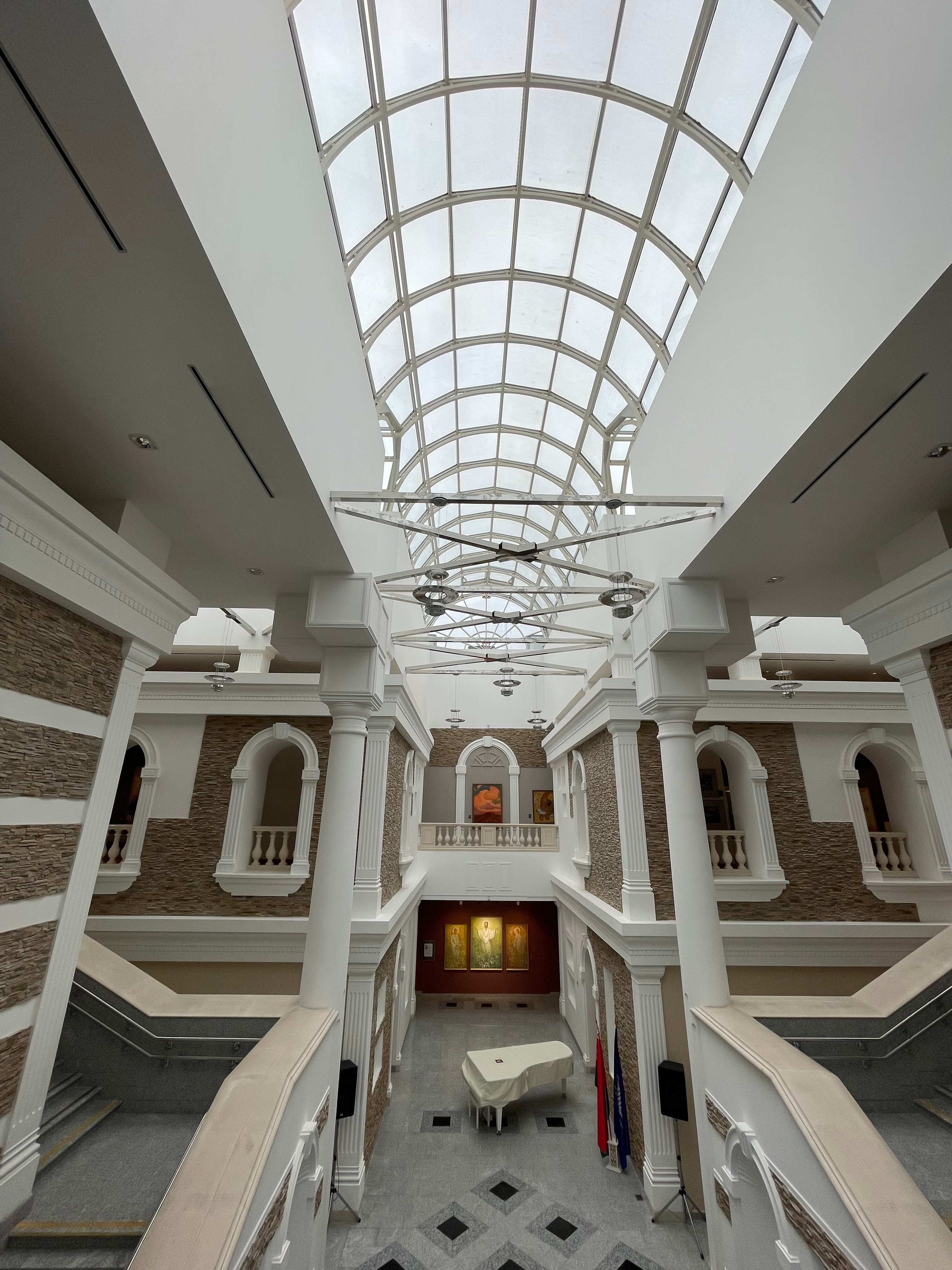 Elegant Atrium with Glass Ceiling and Piano · Free Stock Photo