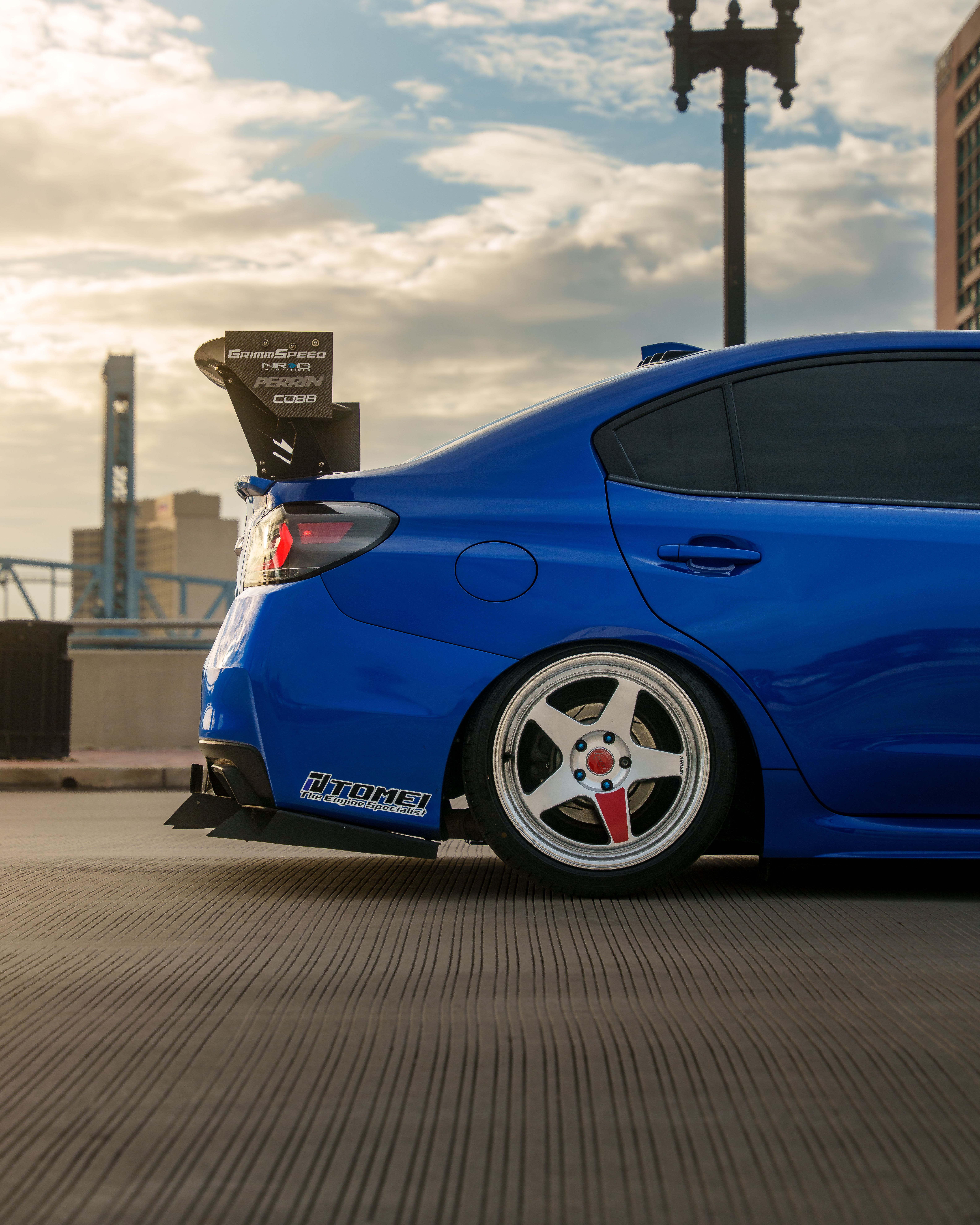 Vibrant Blue Modified Car in Urban Setting · Free Stock Photo