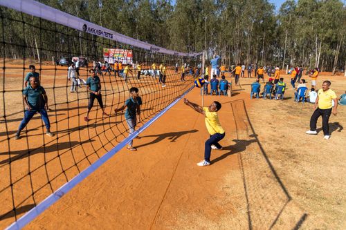 Free Engaging outdoor volleyball match with active players surrounded by nature. Stock Photo