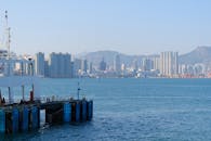 Harbor View of Hong Kong Skyline with Ferry Dock