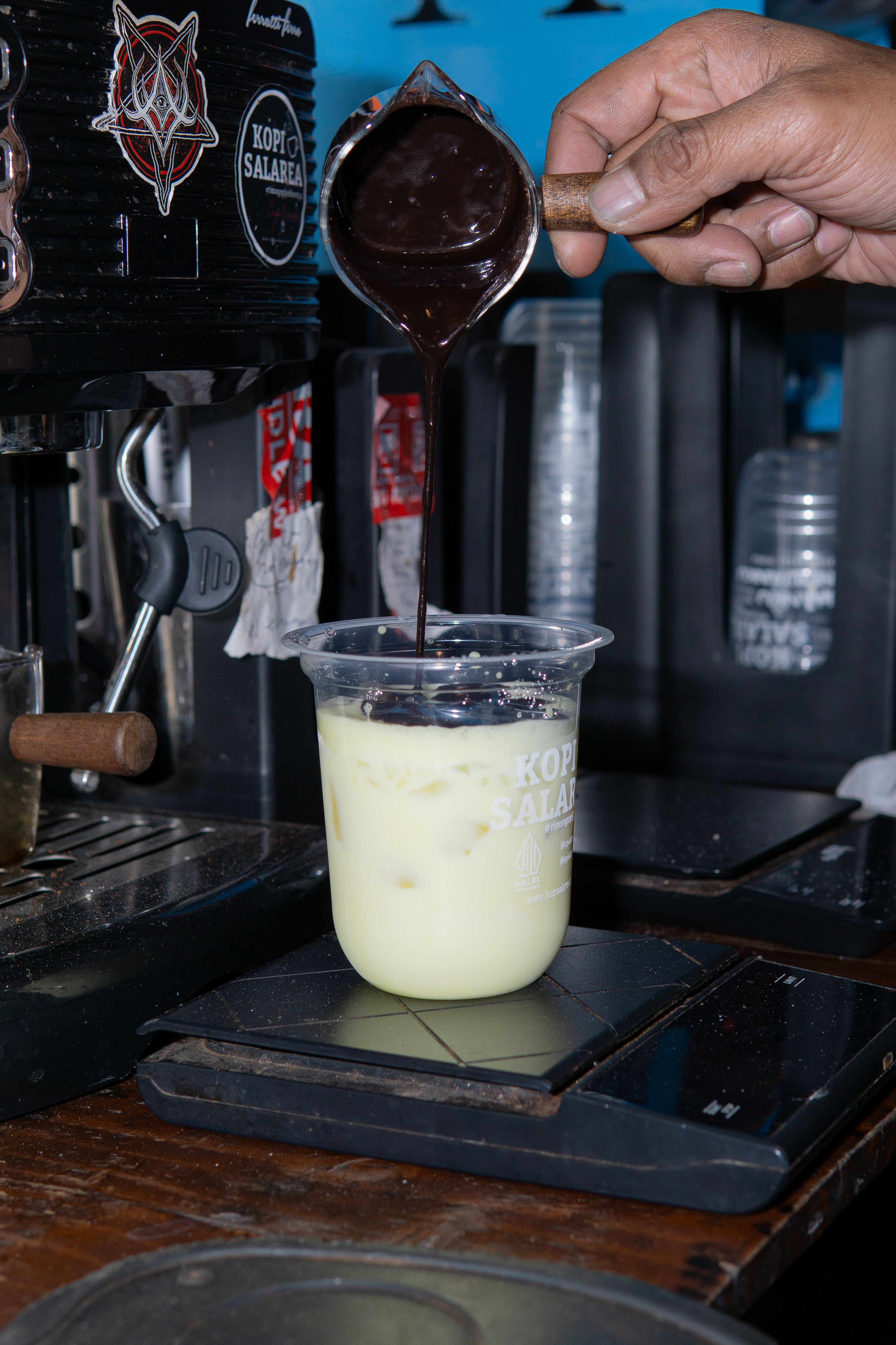 Rich Chocolate Sauce Poured into Iced Coffee