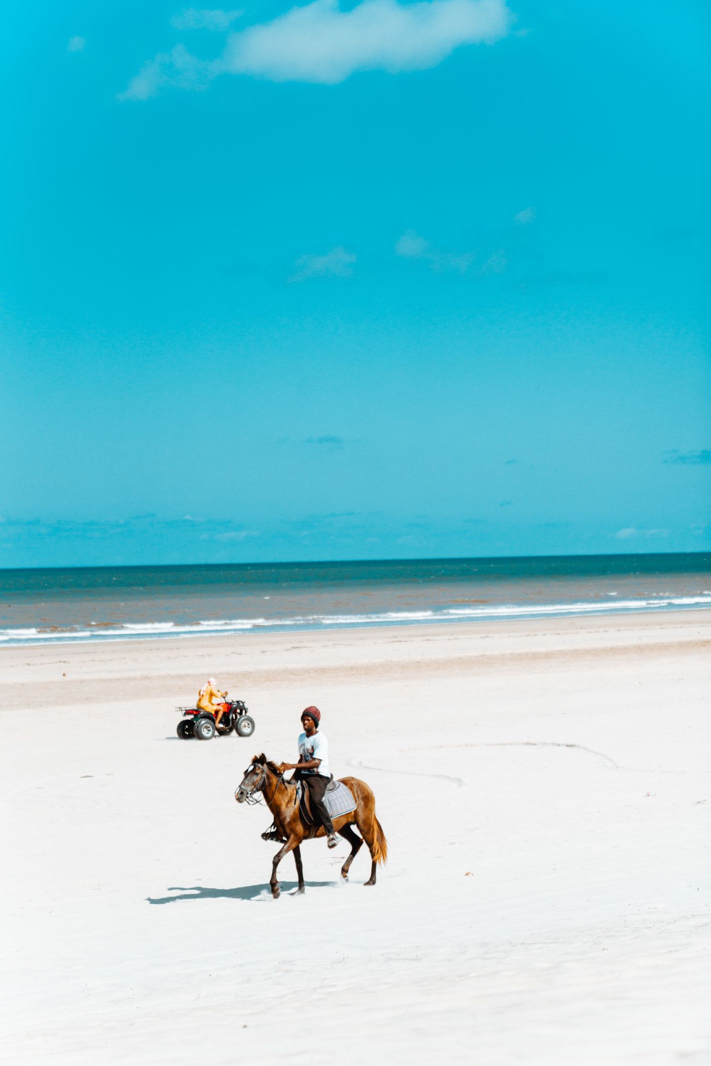 A rider on horseback on Mambrui Beach on the Kenyan coast