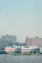 Colorful Boat Passing Dhaka Riverscape