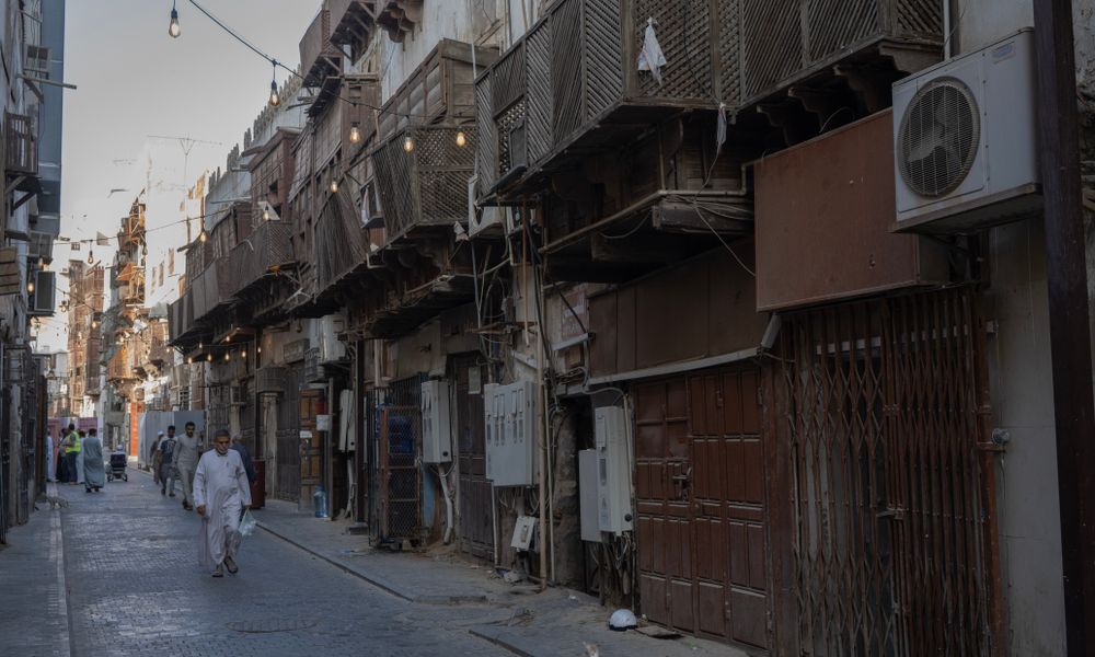 female traveler walking jeddah al-balad