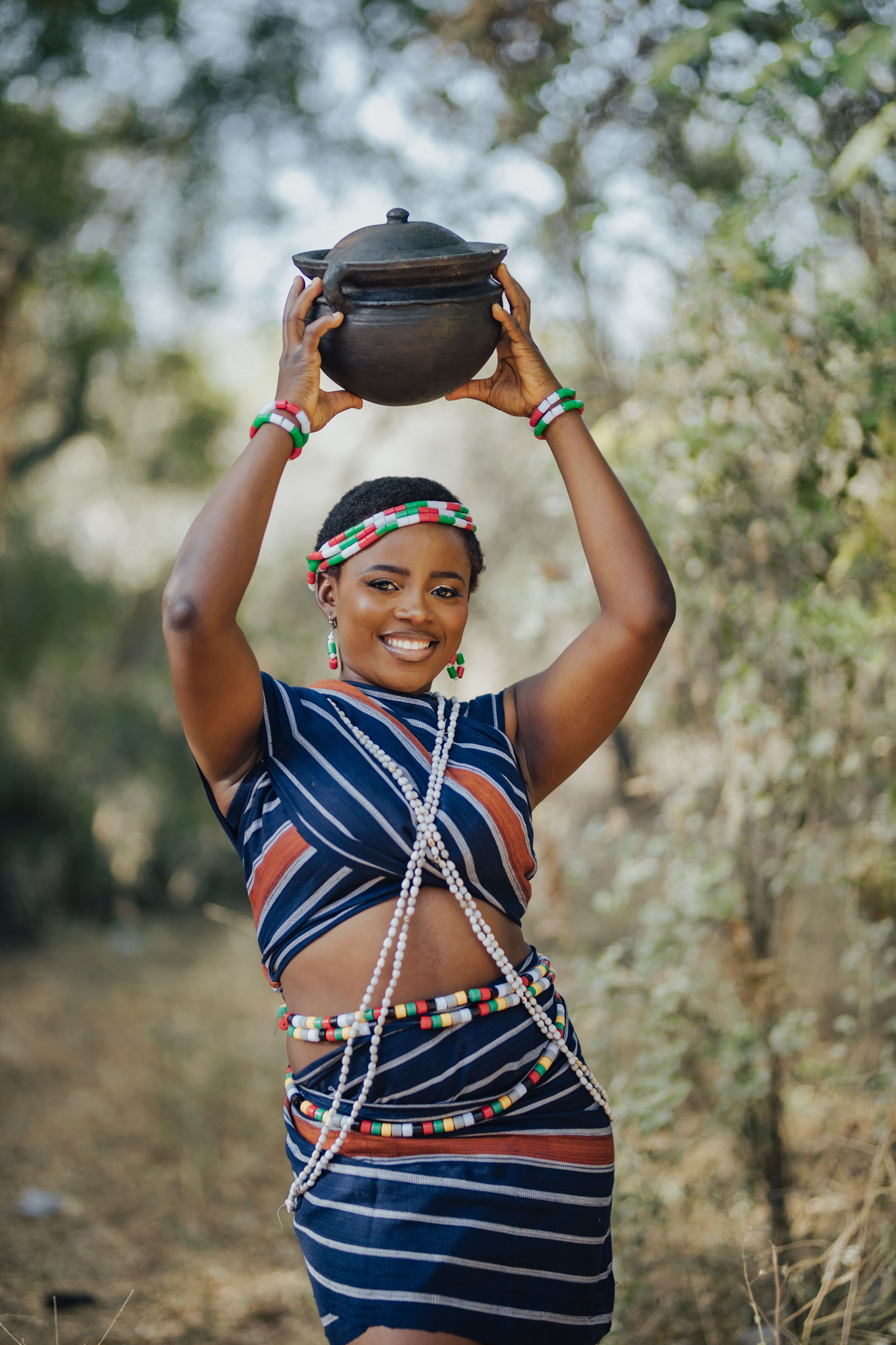 Joyful African Woman in Traditional Clothing Outdoors · Free Stock Photo