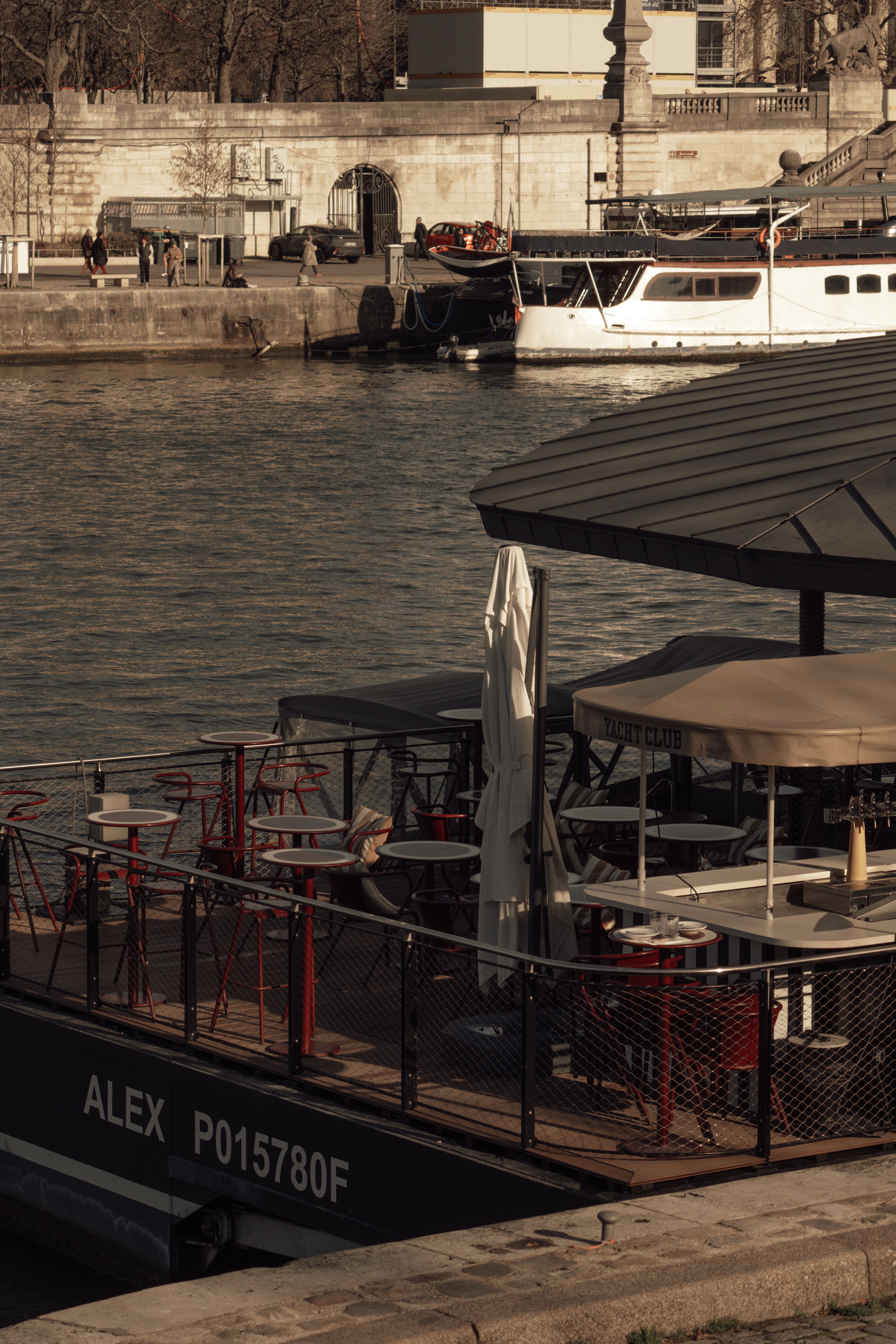 Discover tranquil afternoons at a Seine riverfront café in Paris.
