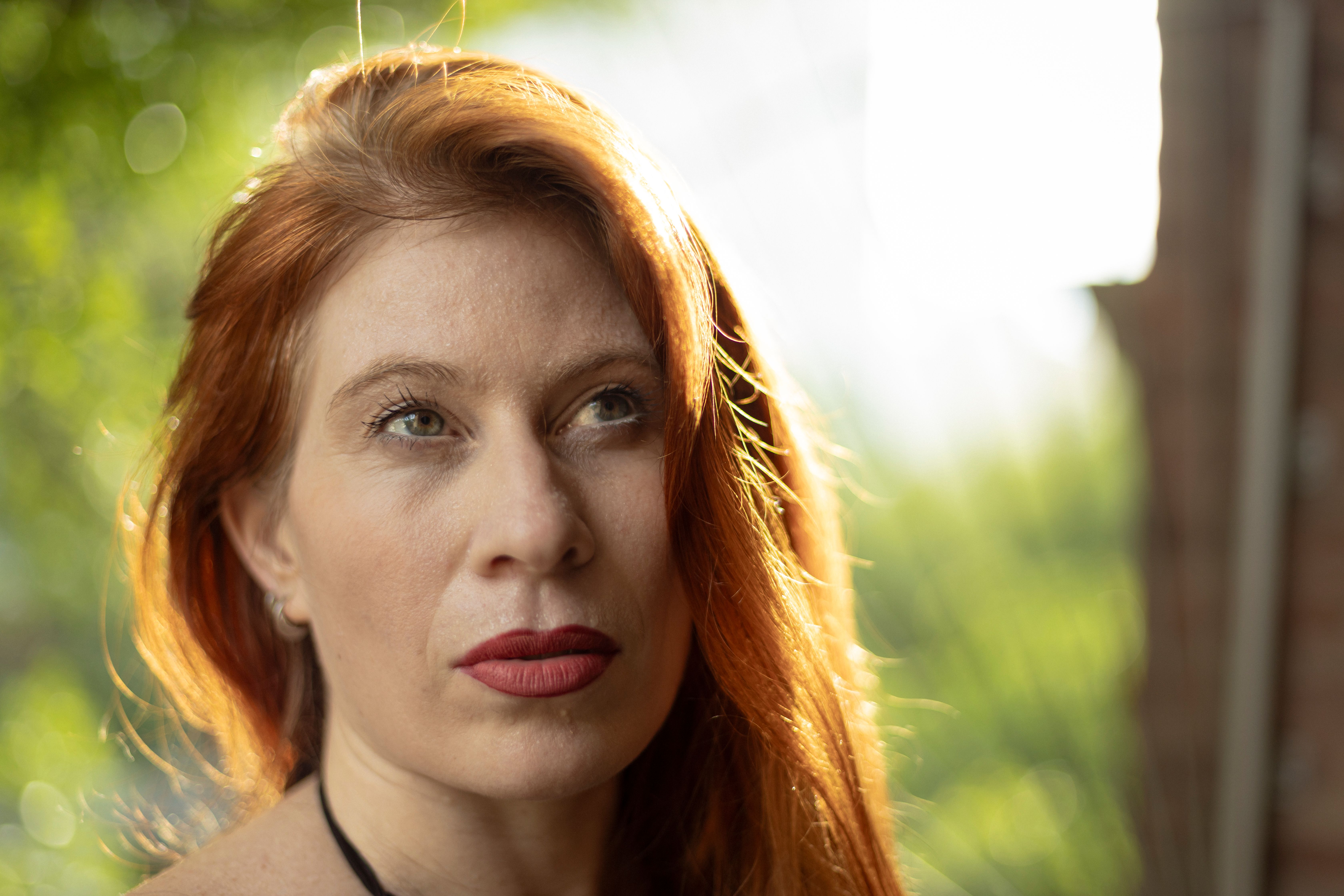 Portrait of a Woman with Red Hair in Natural Light · Free Stock Photo