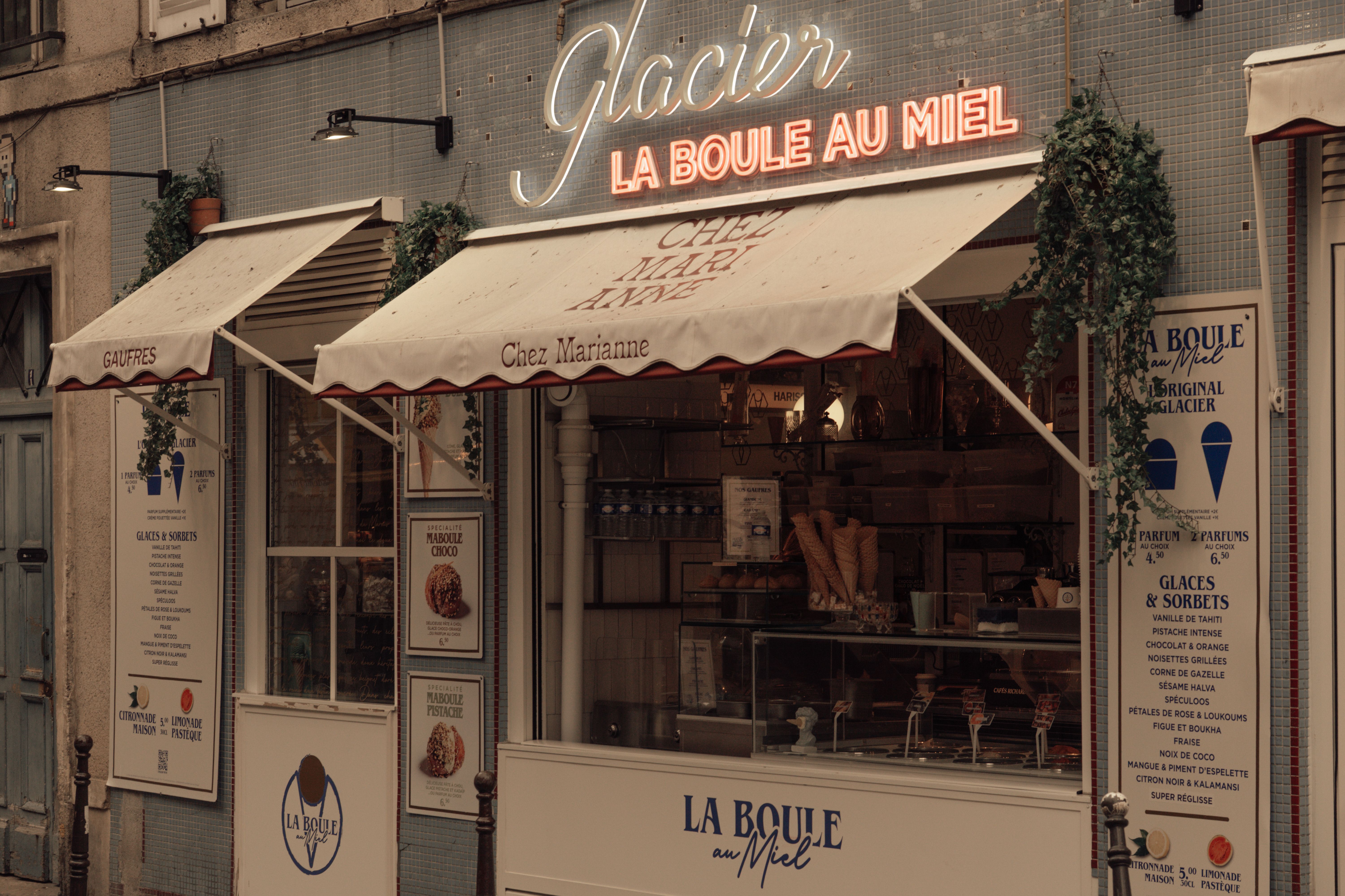 Charming Parisian Ice Cream Shopfront in Pastel Tones · Free Stock Photo