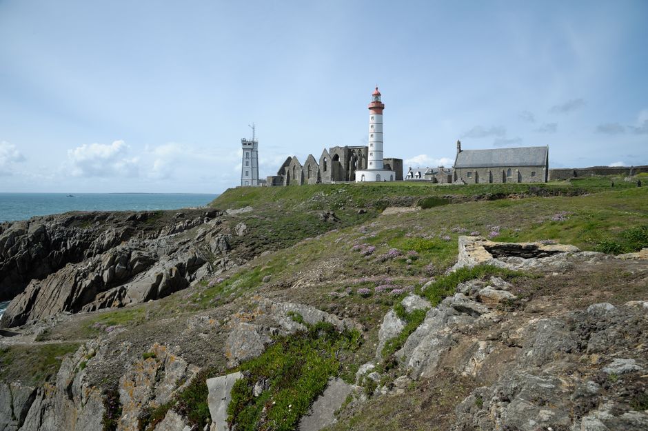 dramatic coastal cliffs lighthouse ocean Brittany