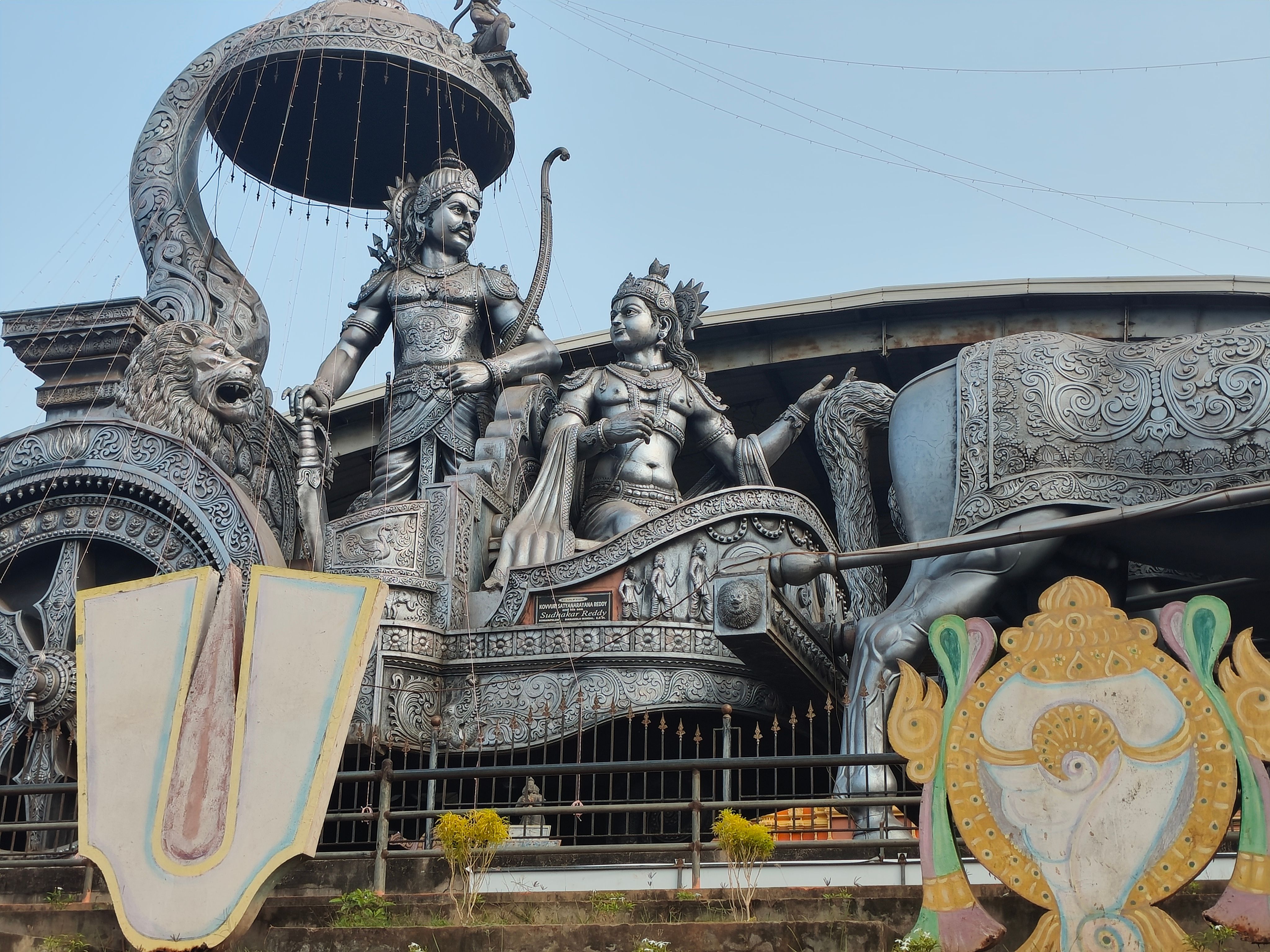 Stunning sculpture of Arjuna and Krishna on a chariot, depicting a scene from Mahabharata.