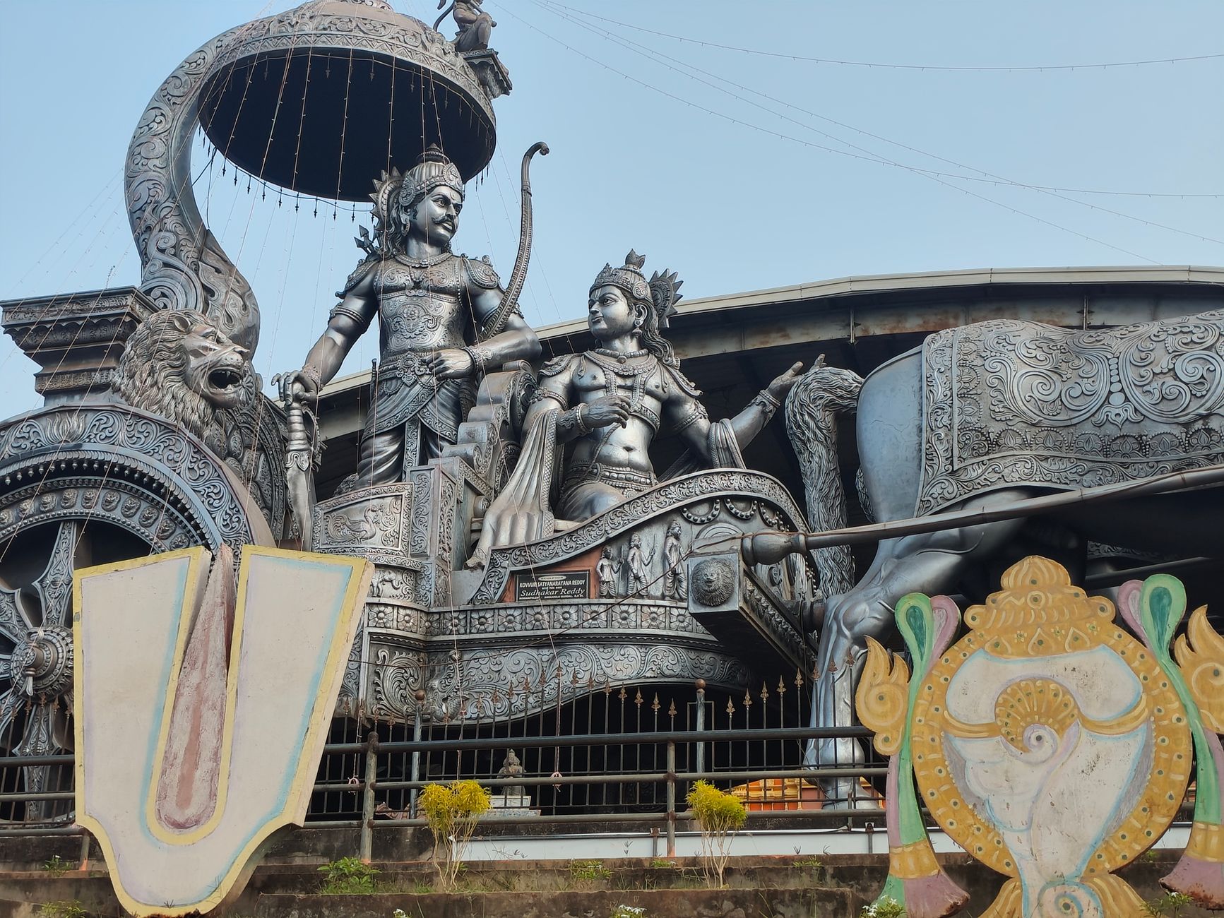 Stunning sculpture of Arjuna and Krishna on a chariot, depicting a scene from Mahabharata.