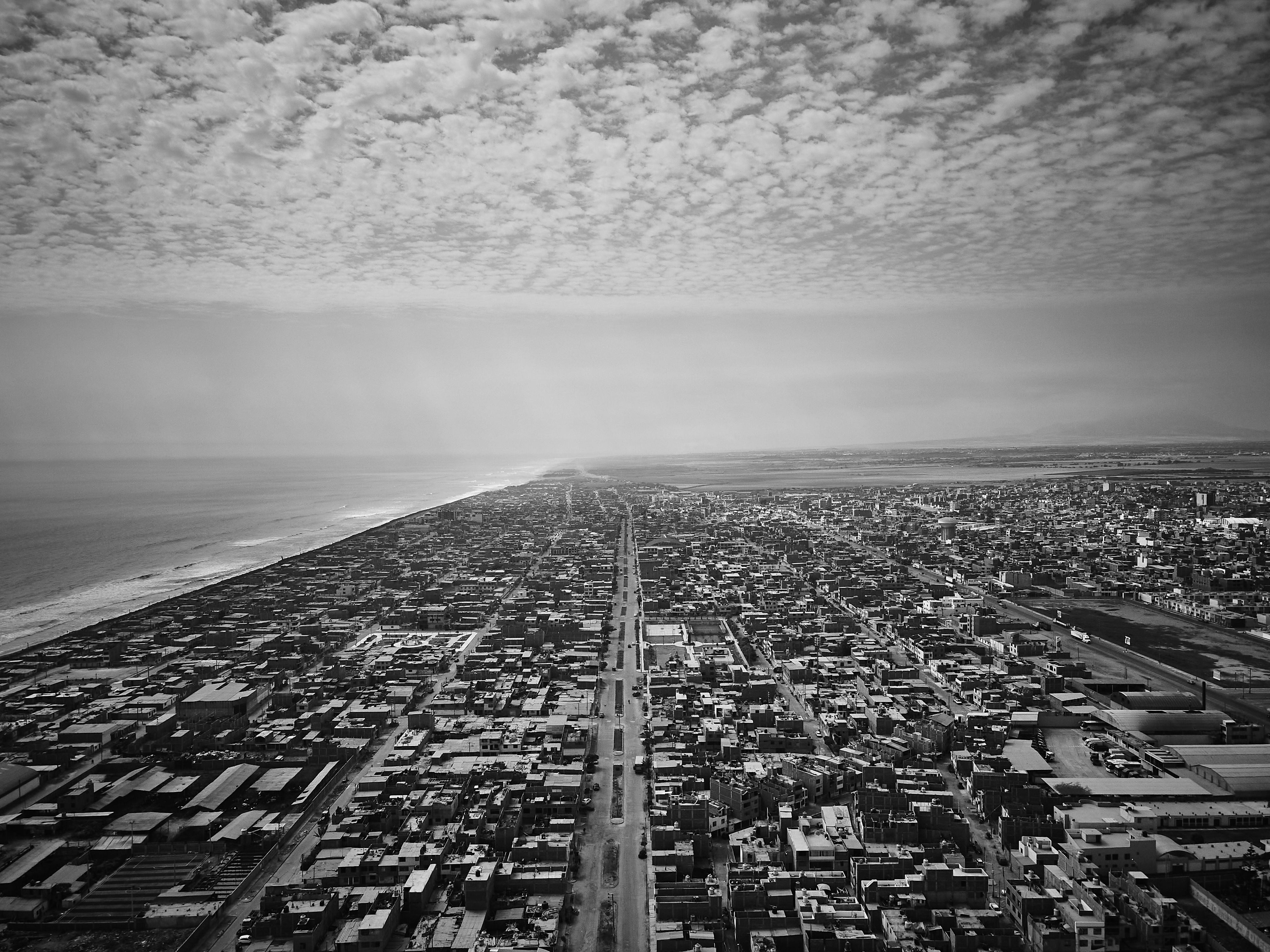 Aerial View of Coastal City and Ocean · Free Stock Photo