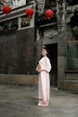 Elegant Woman in Traditional Dress with Red Lanterns