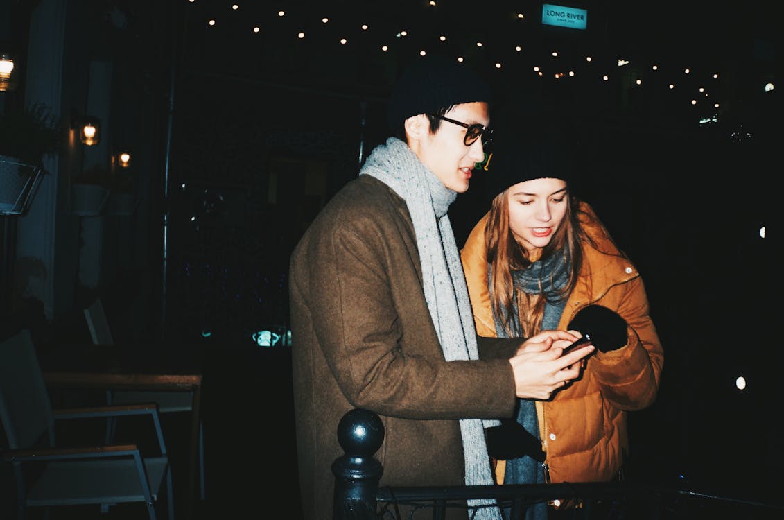 Man And Woman Wearing Winter Clothing