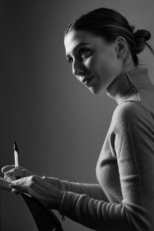 Elegant Black and White Portrait of Woman Writing · Free Stock Photo