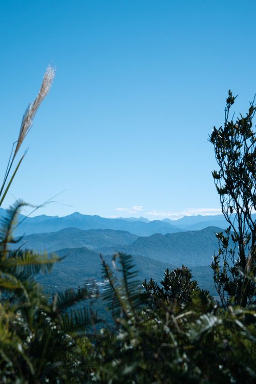 Free Breathtaking view of mountain range under a clear blue sky, ideal for nature and travel themes. Stock Photo