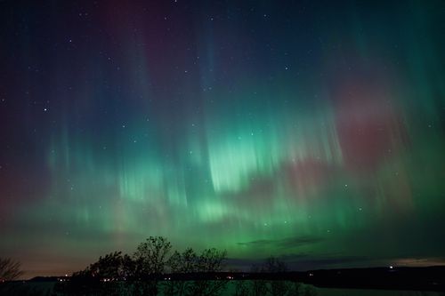 Free Vibrant Northern Lights illuminate the night sky over Reads Landing, Minnesota. Stock Photo