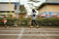 Young Woman Skillfully Walking on Stilts Outdoors