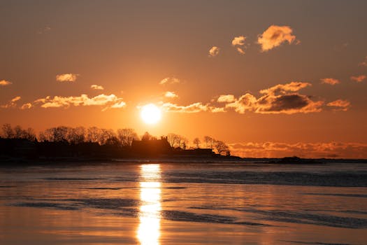 Breathtaking winter sunrise over a frozen cove at Cove Island Park, Stamford, Connecticut.