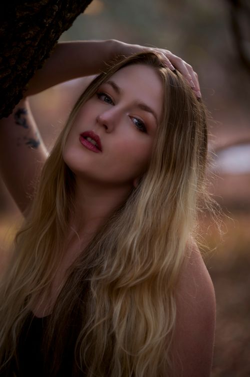 Free Captivating portrait capturing natural beauty and serene mood outdoors. Stock Photo