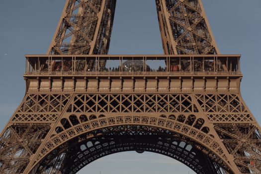 A detailed close-up of the Eiffel Tower's intricate iron lattice in Paris, France.